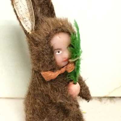 Figurine of fur covered rabbit with carrot