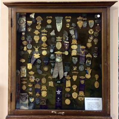 Shadow box display with Elks' Lodge badges, early 1900s