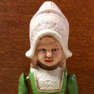 Celluloid doll with stationary body & movable arms, moulded Dutch costume, c. 1920s