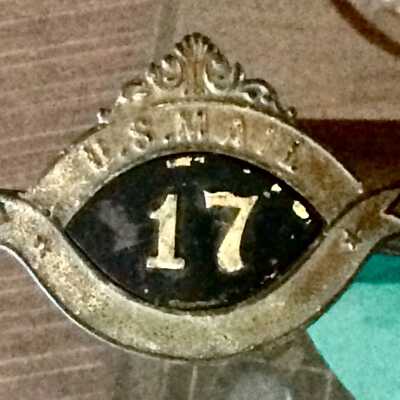 Mail carriers cap emblem for route 17 of Hal Chrisman, before 1922