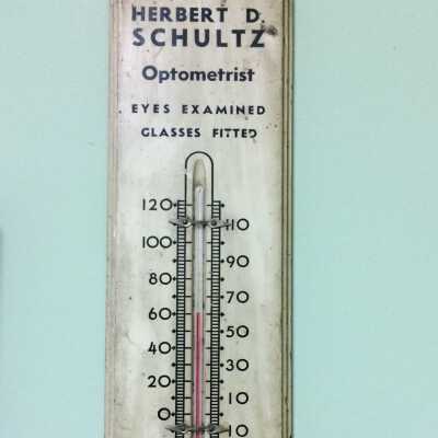 Advertising glass thermometer from Herbert D. Schultz, optometrist, 1930s