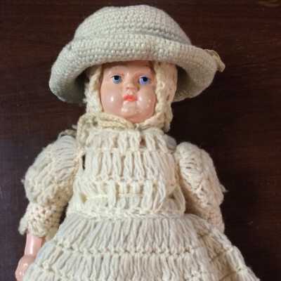 Turtle marked celluloid doll with crocheted clothing, c. 1805-1938