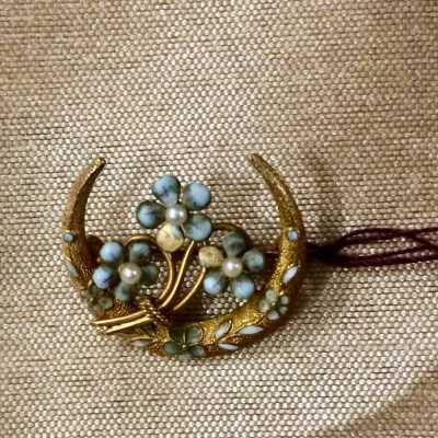 Small brooch with crescent shaped design of 3 flowers with blue petals, c. 1890/1900s