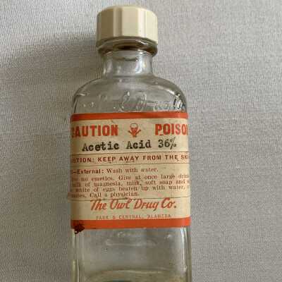 Clear glass medicine bottle from the Owl Drug Co.