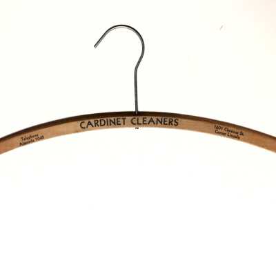 Wooden advertising hanger from Cardinet Cleaners, c. 1940