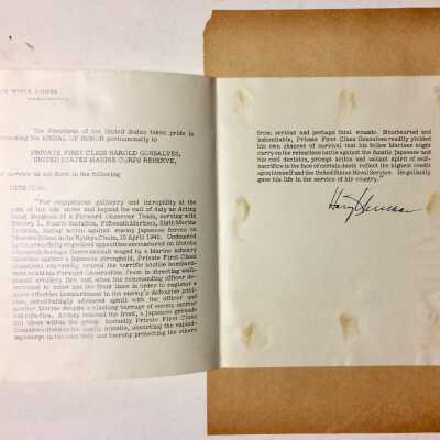 D.: A copy (original copy?) on a unique glossy thin paper, of the White House Citation signed by President Truman. See 17.5.10.