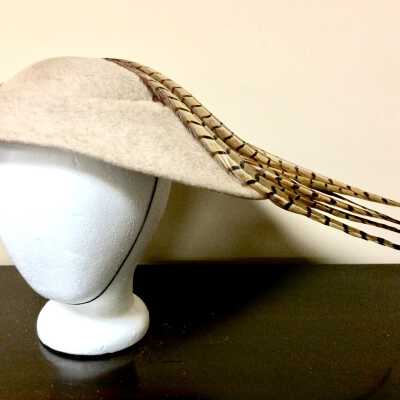 Oval imitation fur hat trimmed with pheasant feathers of Carol Heche, c. 1940s