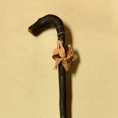 Child's walking cane of manzanita wood with bow, late 1890s