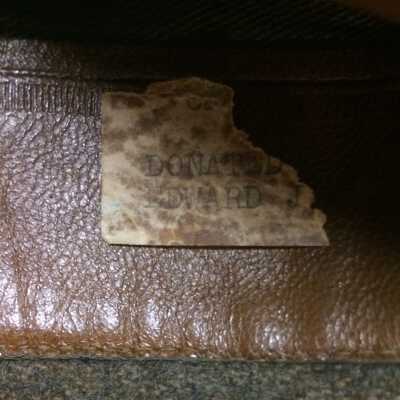 Partial paper label ticked inside