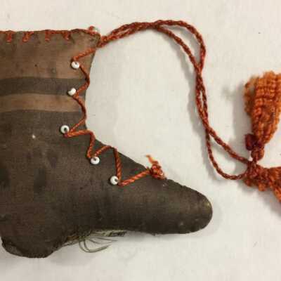 Pin cushion in the form of a high-button boot, c. 1900