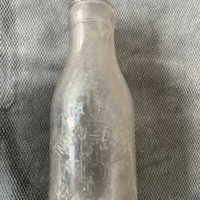 Pint size milk bottle from the Innes Dairy, c. 1920