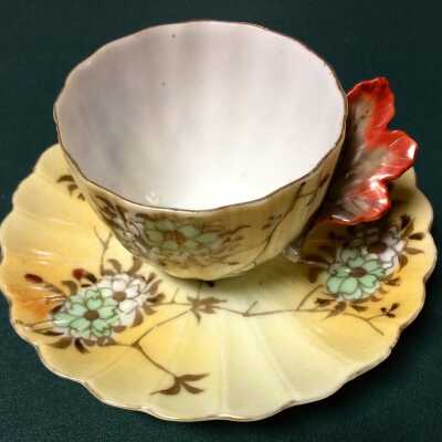 Demitasse cup and saucer of handpainted Japanese porcelain of the Clinton family, early 1900s