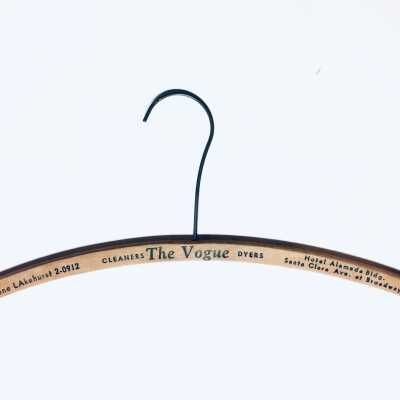 Wooden hanger advertising Vogue Cleaners and dyers, prior to 1970