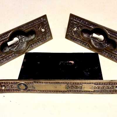 Sliding door escutcheons from 1567 Pacific Ave., prior to 1885