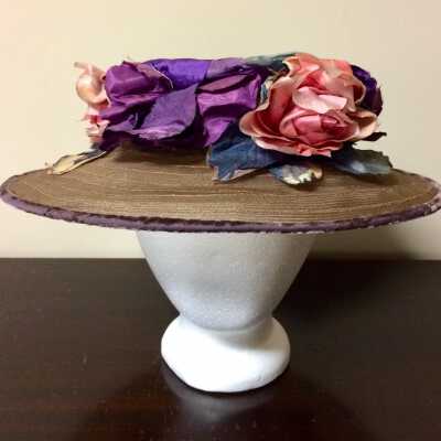 Tan horsehair hat with wide brim, grape-colored velvet, and silk flowers, 1920s
