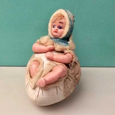Plaster-of-Paris child in cracking egg candy container, c. 1910