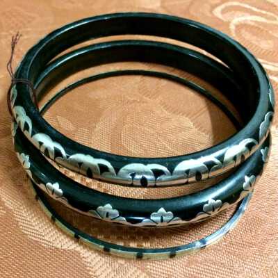 Set of black plastic bracelets with silver accents of Anne Macdonald