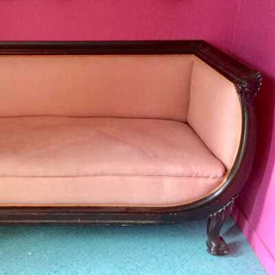 Pseudo-empire loveseat with clawfeet and lion's heads, c. 1900s