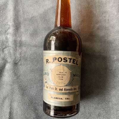 R. Postel whiskey bottle, early 1900s