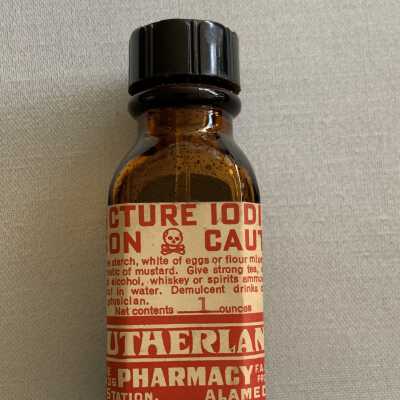Dark amber glass bottle of Tinc. Iodine purchased at Sutherland Pharmacy, c. 1950