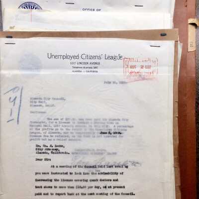 Folder from City Hall with documents about permits, 1923-1932