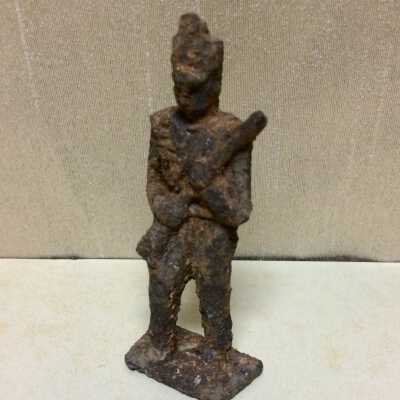 Metal toy soldier excavated from yard of 1308 St. Charles Street., c. 1900