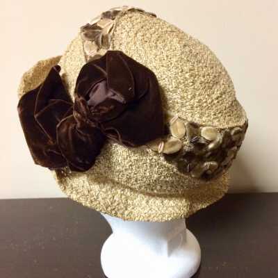 Straw hat trimmed with stylized leaves and a brown bow, 1920s