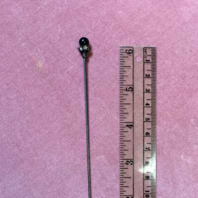 Hat pin with black glass ball head surrounded by rhinestones, early 1900s