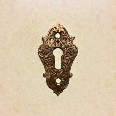 Key escutcheon of 1567 Pacific Avenue, pre 1885