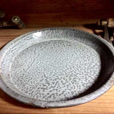 Circular graniteware pie plate of the Cox family, c. 1920s
