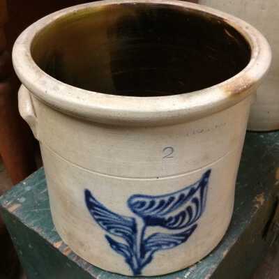 Buff earthenware crock with blue lily design, before 1920