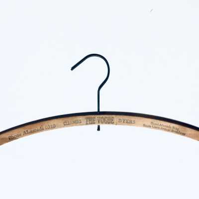 Wooden hanger advertising Vogue Cleaners and Dyers, prior 1970