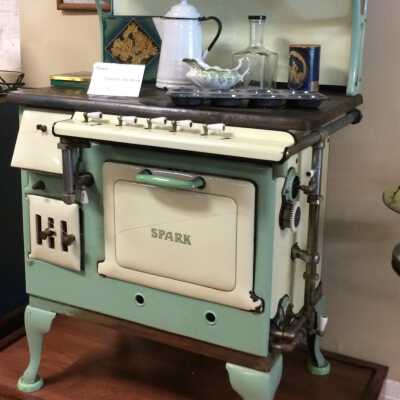 Green and yellow enamel Spark stove, late 1920s