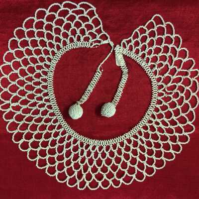 Collar of white seed beads with ball finial ties, 1930-1950