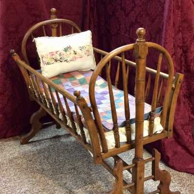 Swinging wooden cradle used by the Testa family, c. early 1900s