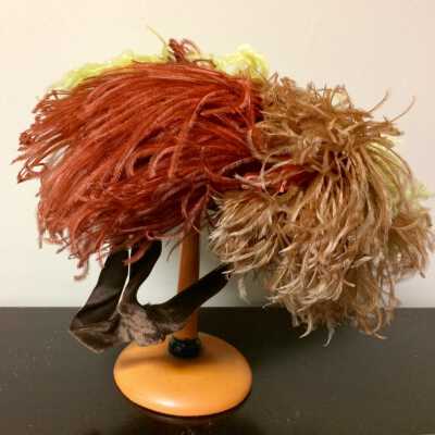 Brown velvet hat with rust, brown and yellow ostrich feathers, early 1940s