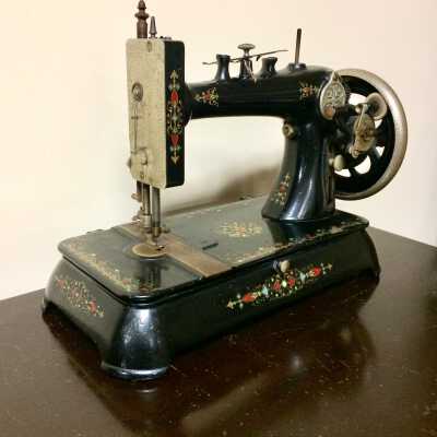 Crank type, cast-iron sewing machine in cast iron base, c. 1880-1890