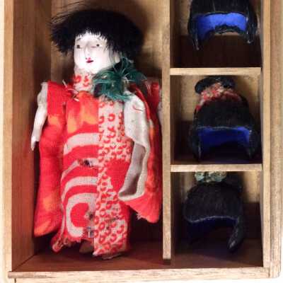 Miniature Japanese doll with 5 wigs, c. 1920