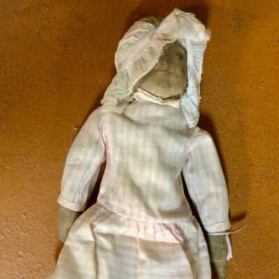B: Front of doll B