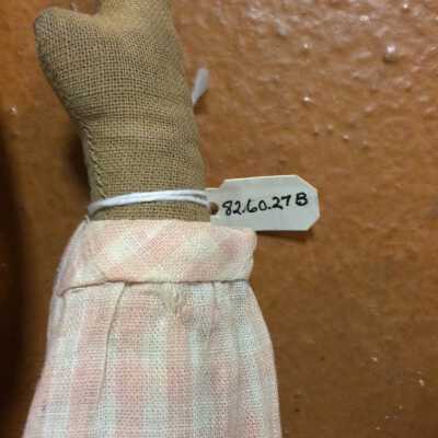Doll B number tag
