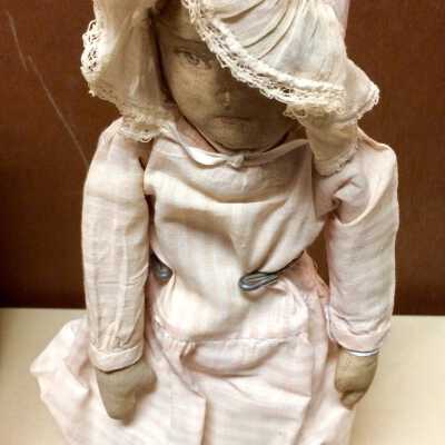 Pair of Cloth body dolls with checked dresses and white bonnets, c. 1910