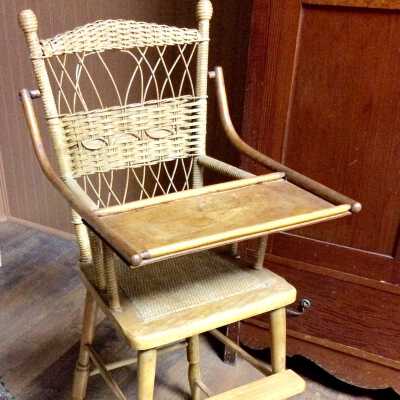Highchair with woven wicker back and hinged serving tray, c. 1895-1896