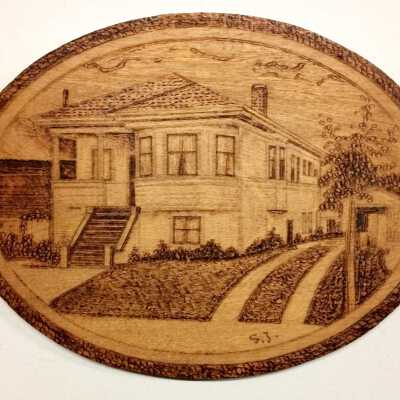 Wooden plaque depicting main facade Ekberg home, 1807 Elm Street, c. 1920s