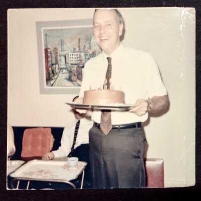Frank Perkins: Loose photo in front of album 