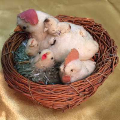 Easter Decoration with hen and four chicks in basket