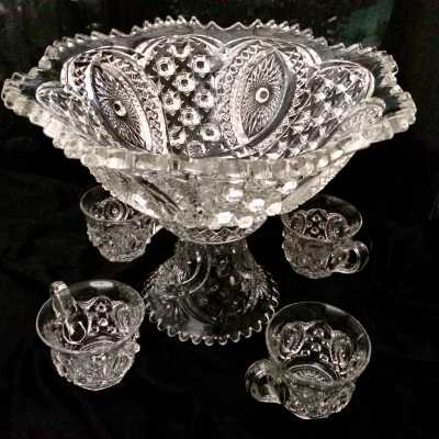 Pressed-glass punch bowl with cups by Northwood, early 1900s