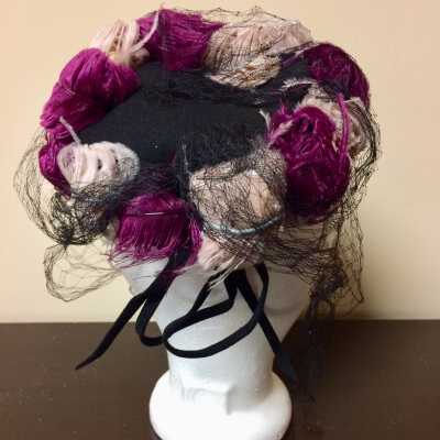 Hat of black felt with colored feathers, net veil, and bow, 1940s