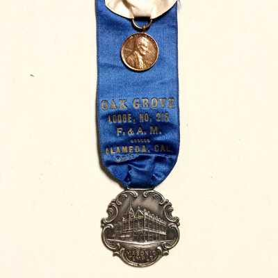 Blue and white silk souvenir ribbons from the Masonic Oak Grove Lodge, 1909