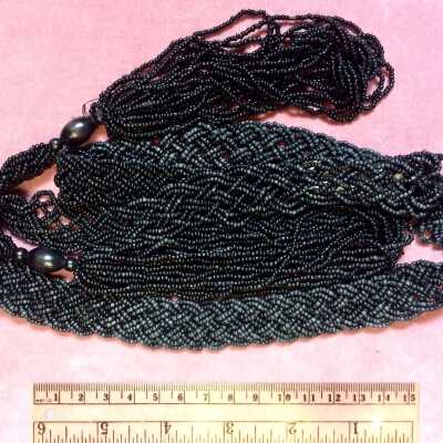 Necklace of woven black glass beads and beaded tassles, early 1900s