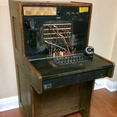 Telephone switchboard in oak cabinet of the Loop Lumber Co., c. 1920s